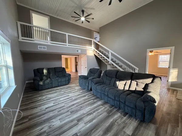 a living room with furniture and a window