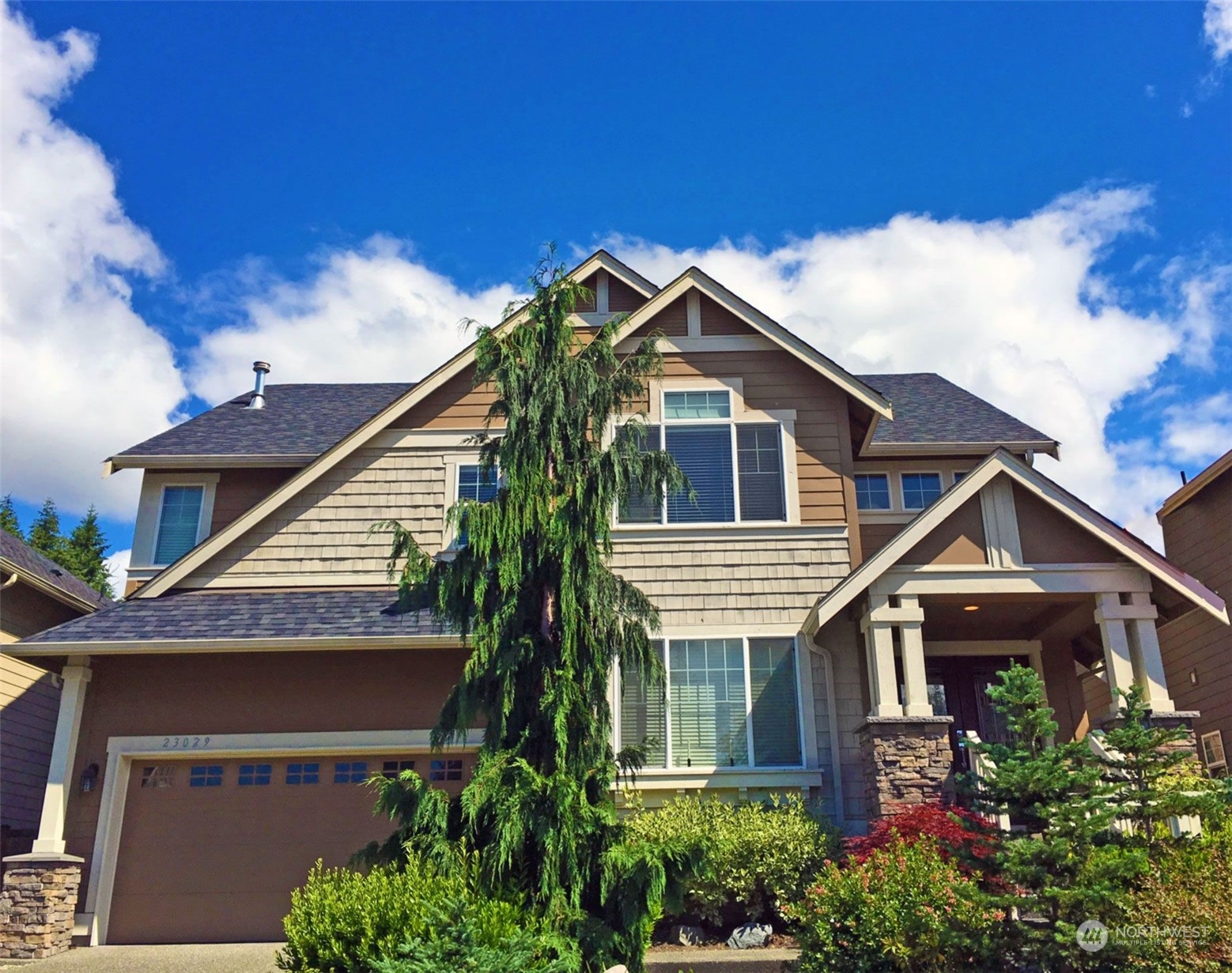 23029 35th Drive Southeast Bothell, WA 98021 - Photo 2 of 40 a front view of a house with a yard