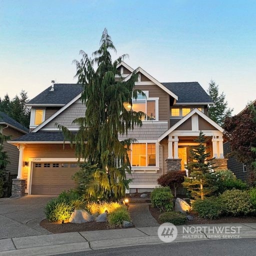 23029 35th Drive Southeast Bothell, WA 98021 - Photo 4 of 40 a front view of a house with a yard