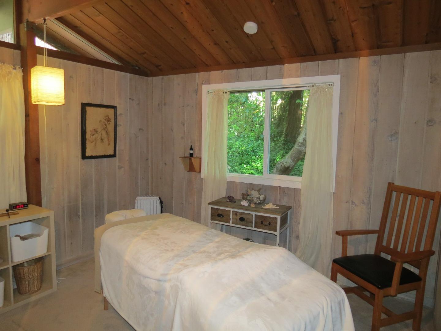 66 Wurr Road Loma Mar, CA 94021 - Photo 12 of 34 a bedroom with a bed and a window