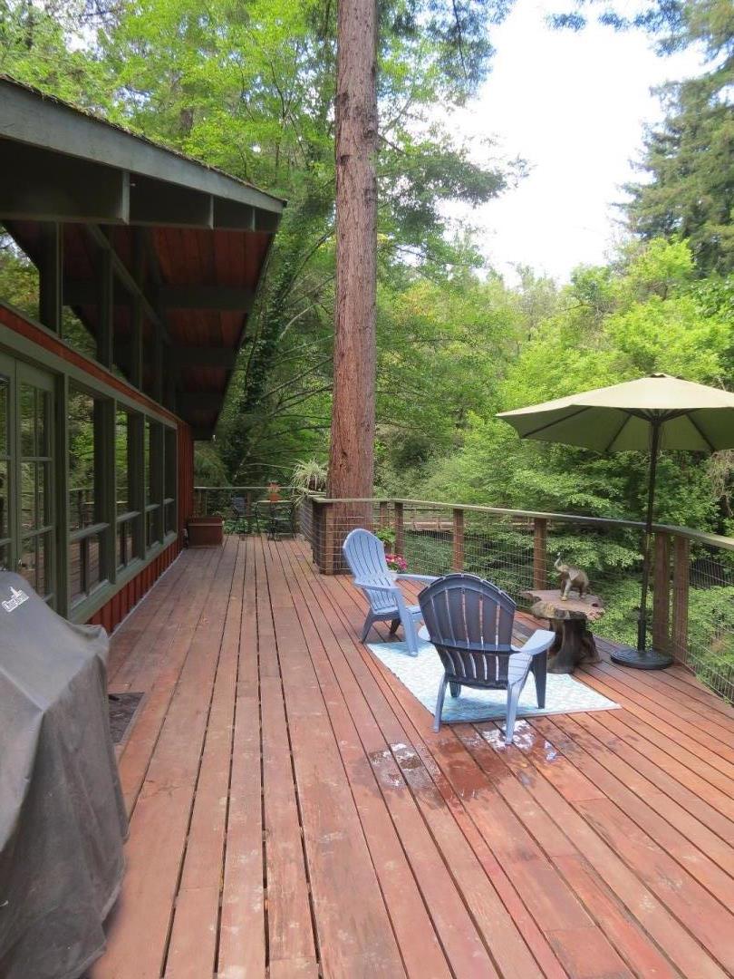 66 Wurr Road Loma Mar, CA 94021 - Photo 18 of 34 a view of backyard with hardwood floor and outdoor seating