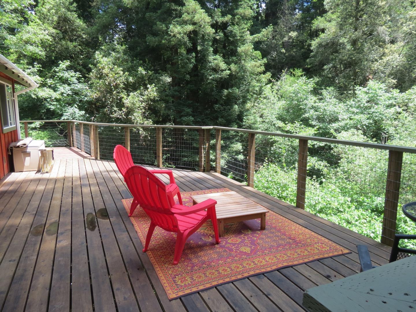 66 Wurr Road Loma Mar, CA 94021 - Photo 19 of 34 a view of deck with couches and wooden floor