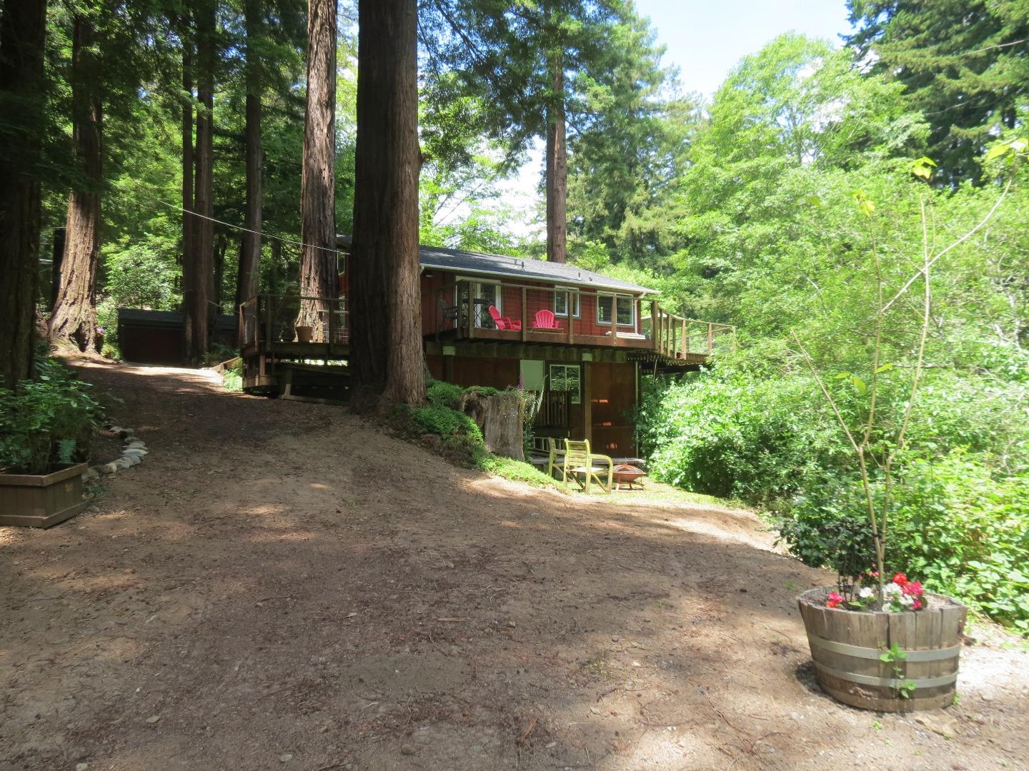 66 Wurr Road Loma Mar, CA 94021 - Photo 22 of 34 a view of a house with backyard and sitting area