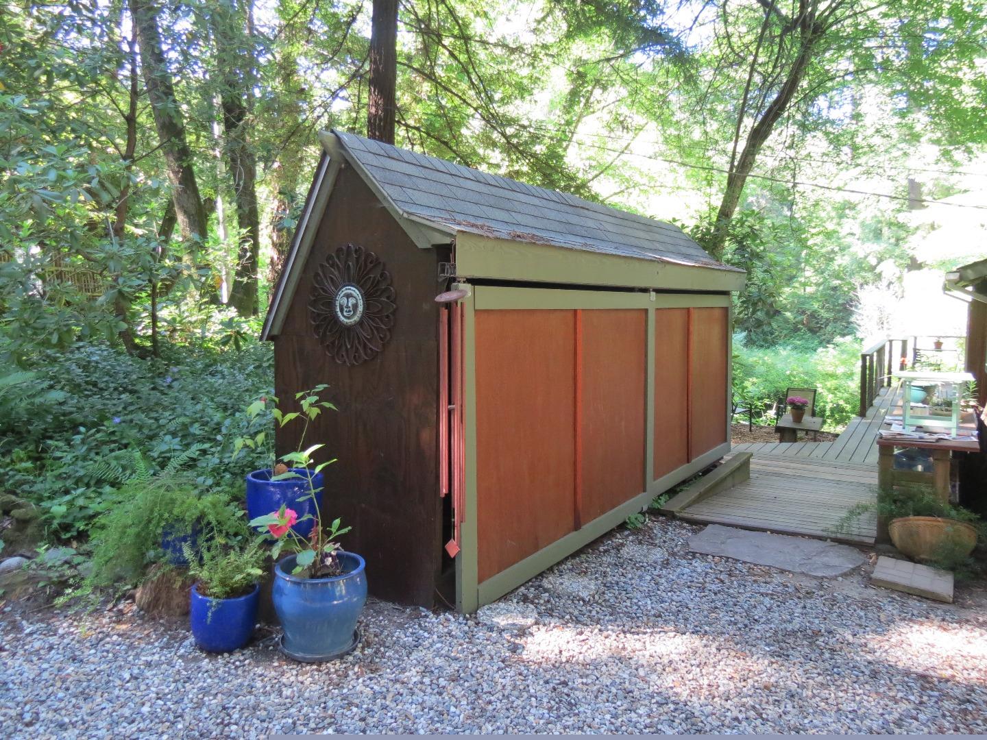 66 Wurr Road Loma Mar, CA 94021 - Photo 33 of 34 a house view with a backyard space