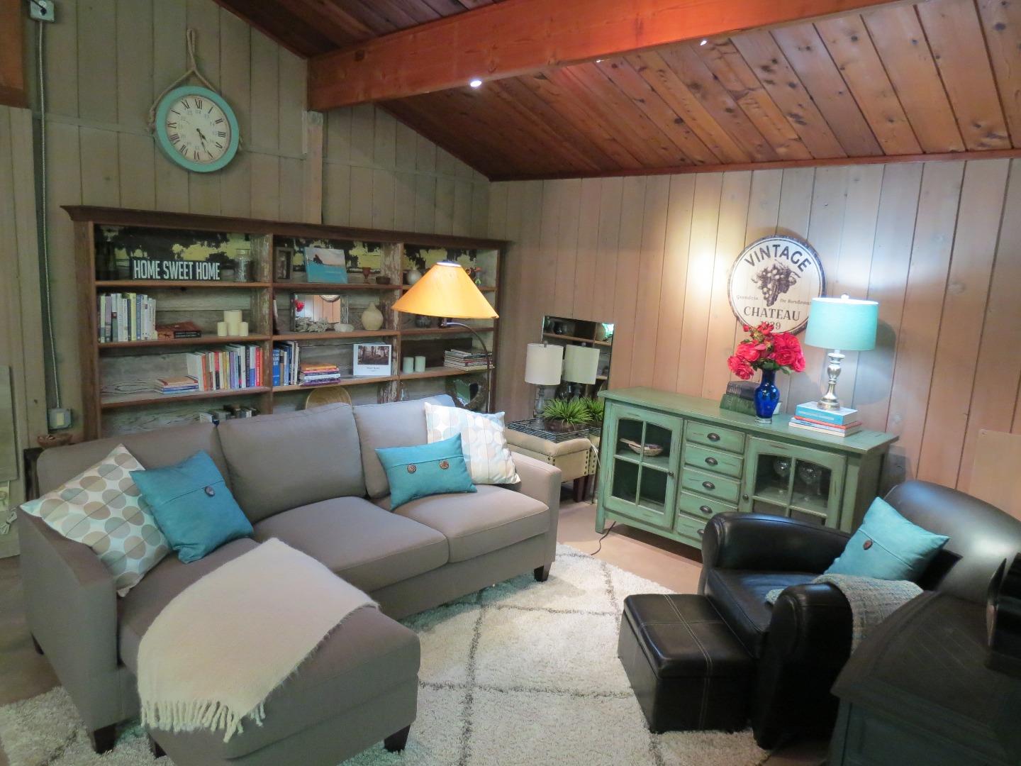 66 Wurr Road Loma Mar, CA 94021 - Photo 5 of 34 a living room with furniture a fireplace and a window