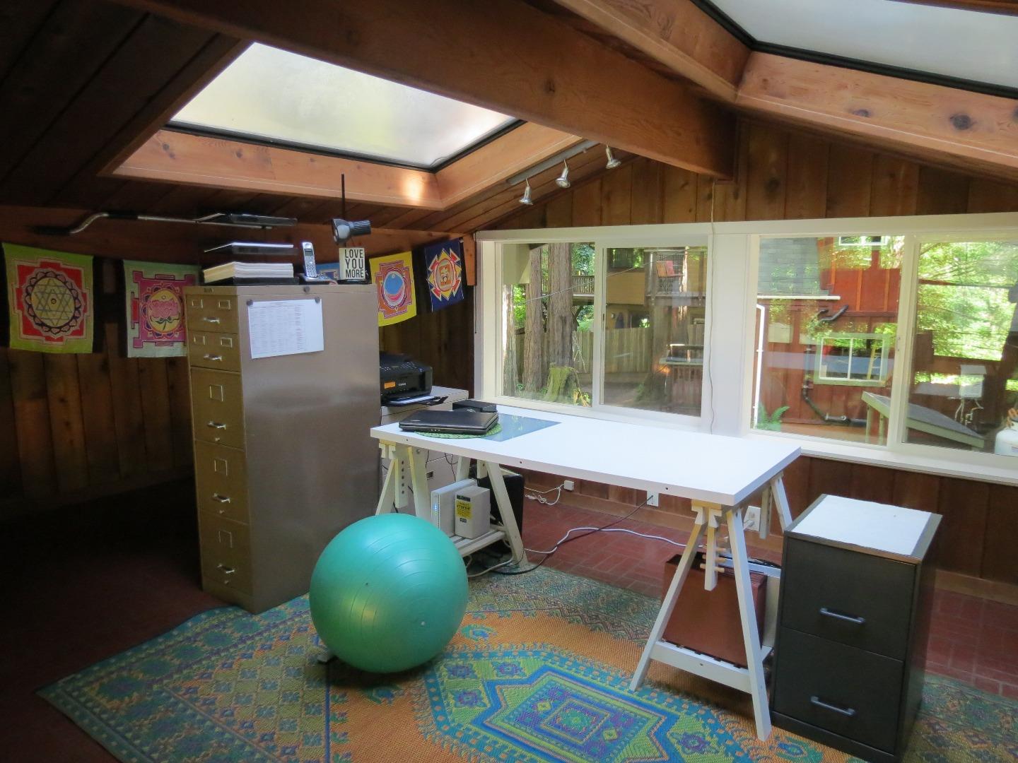 66 Wurr Road Loma Mar, CA 94021 - Photo 10 of 34 a view of a dining room with furniture wooden floor and chandelier