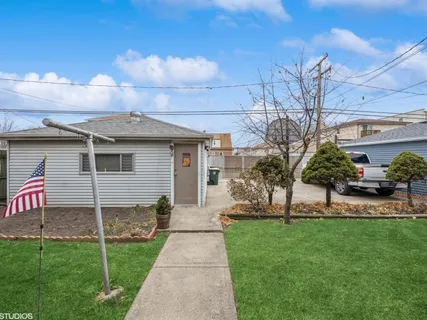a view of a yard with a tree