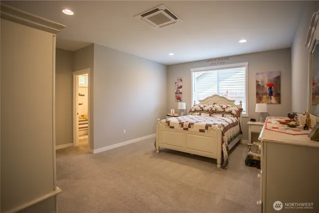 a room with bed and window