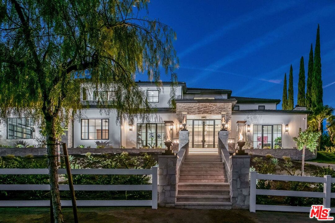 24961 Kit Carson Road Hidden Hills, CA 91302 - Photo 1 of 53 a front view of a house with a porch