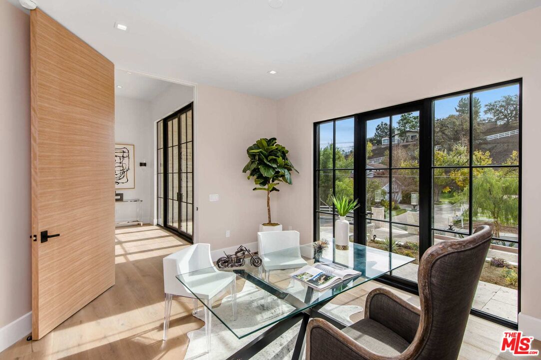 24961 Kit Carson Road Hidden Hills, CA 91302 - Photo 13 of 53 a living room with furniture and potted plant