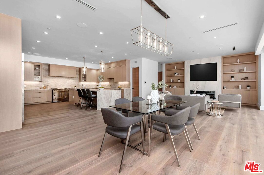 24961 Kit Carson Road Hidden Hills, CA 91302 - Photo 17 of 53 a view of a dining room with furniture