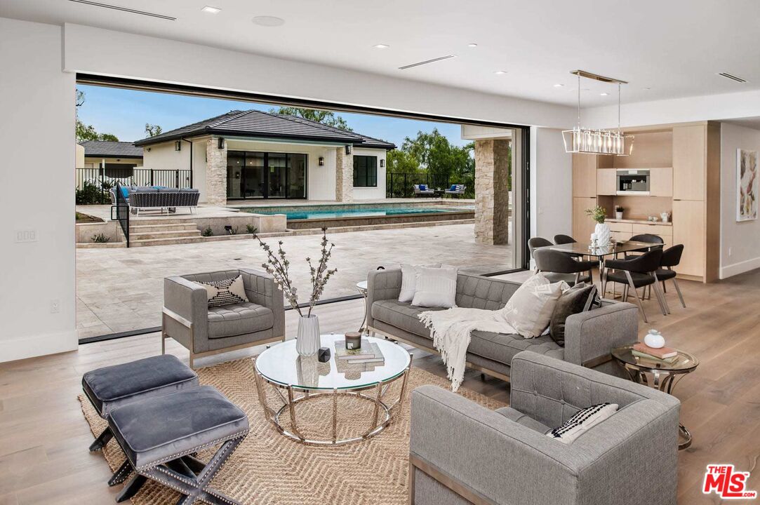 24961 Kit Carson Road Hidden Hills, CA 91302 - Photo 20 of 53 a living room with furniture and a large window