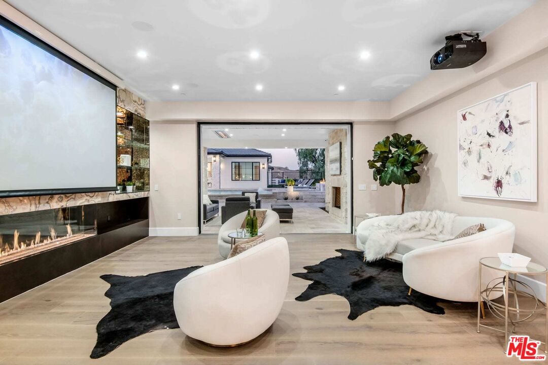 24961 Kit Carson Road Hidden Hills, CA 91302 - Photo 21 of 53 a living room with furniture