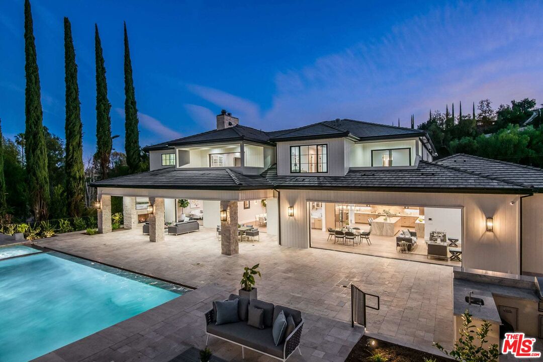 24961 Kit Carson Road Hidden Hills, CA 91302 - Photo 28 of 53 a view of a house with backyard porch and sitting area