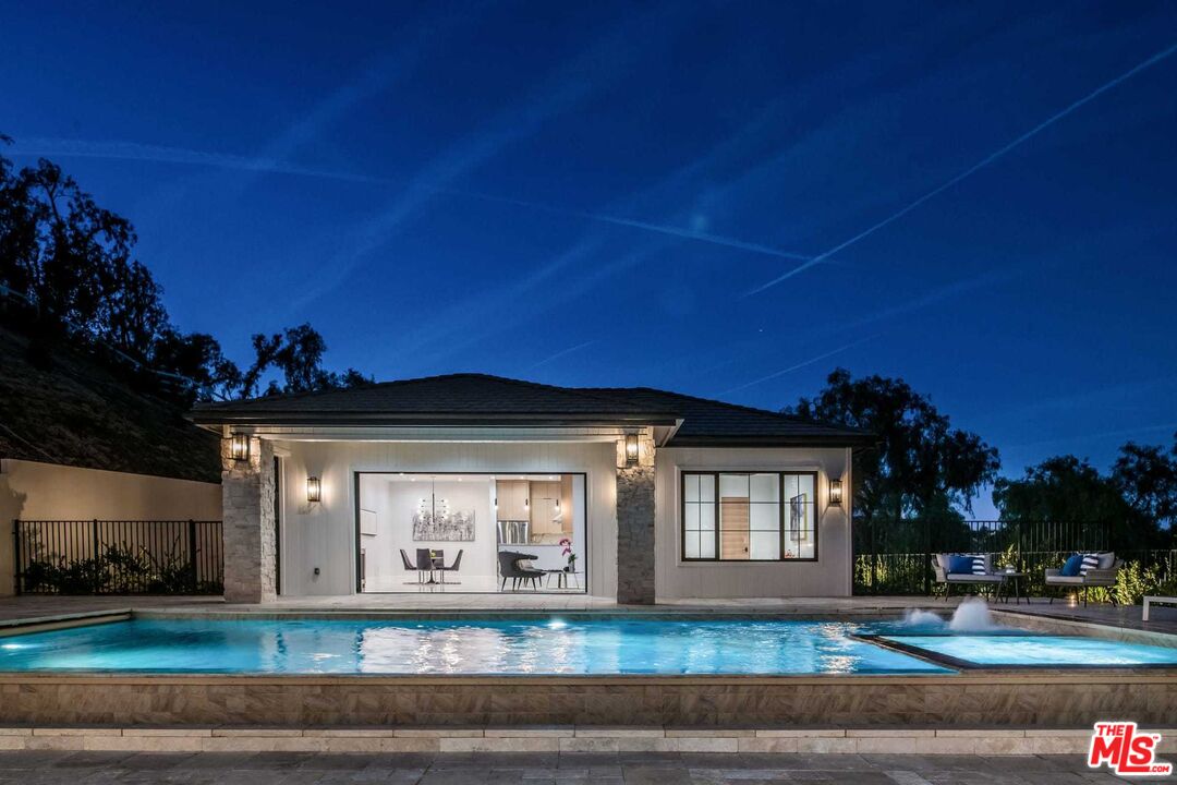 24961 Kit Carson Road Hidden Hills, CA 91302 - Photo 47 of 53 a view of a house with a yard