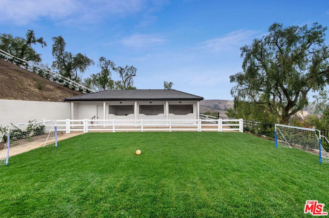 24961 Kit Carson Road Hidden Hills, CA 91302 - Photo 48 of 53 a house view with a sitting space and garden