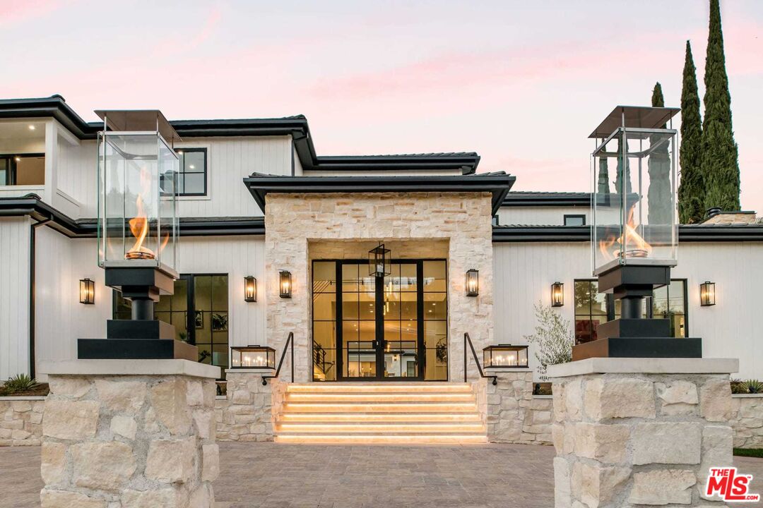 24961 Kit Carson Road Hidden Hills, CA 91302 - Photo 5 of 53 front view of a house with a street