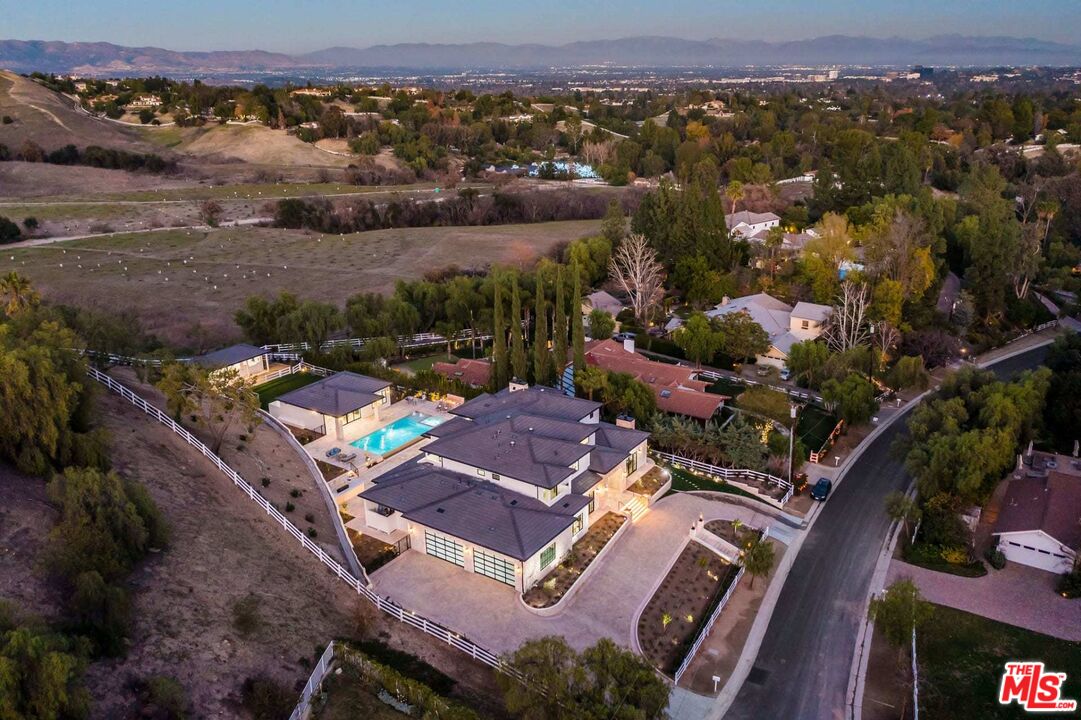 24961 Kit Carson Road Hidden Hills, CA 91302 - Photo 51 of 53 an aerial view of a house with a mountain