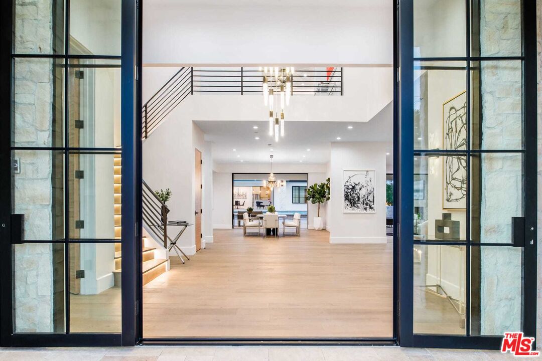 24961 Kit Carson Road Hidden Hills, CA 91302 - Photo 6 of 53 a view of a living room and entry way with furniture