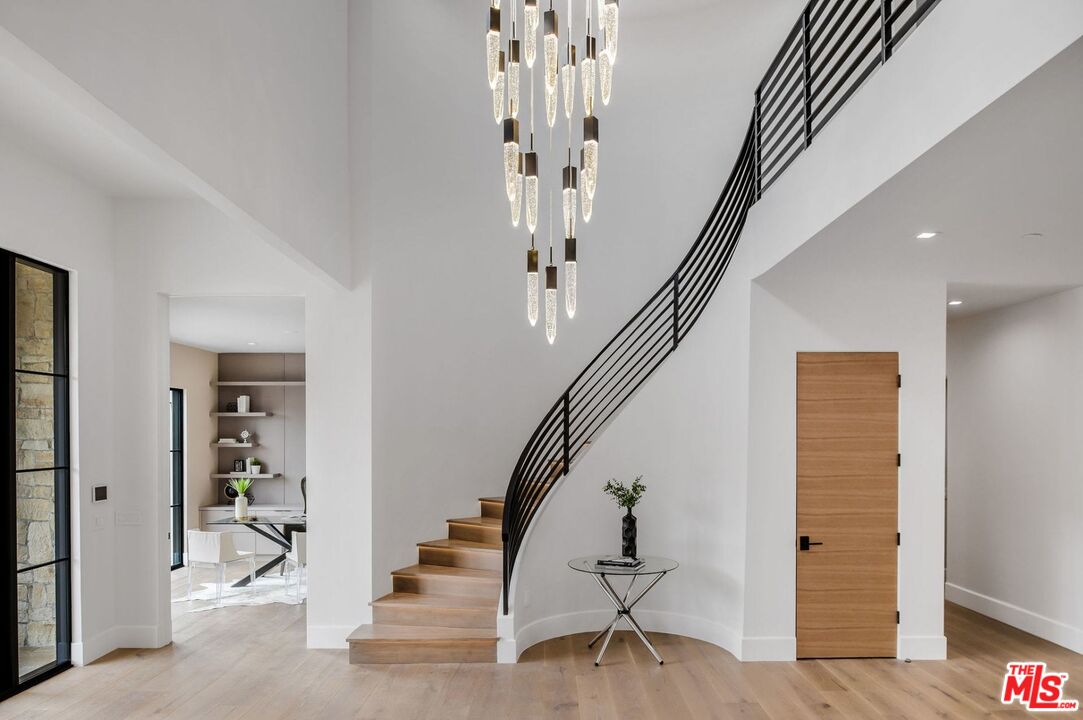 24961 Kit Carson Road Hidden Hills, CA 91302 - Photo 8 of 53 a view of entryway and hall with wooden floor
