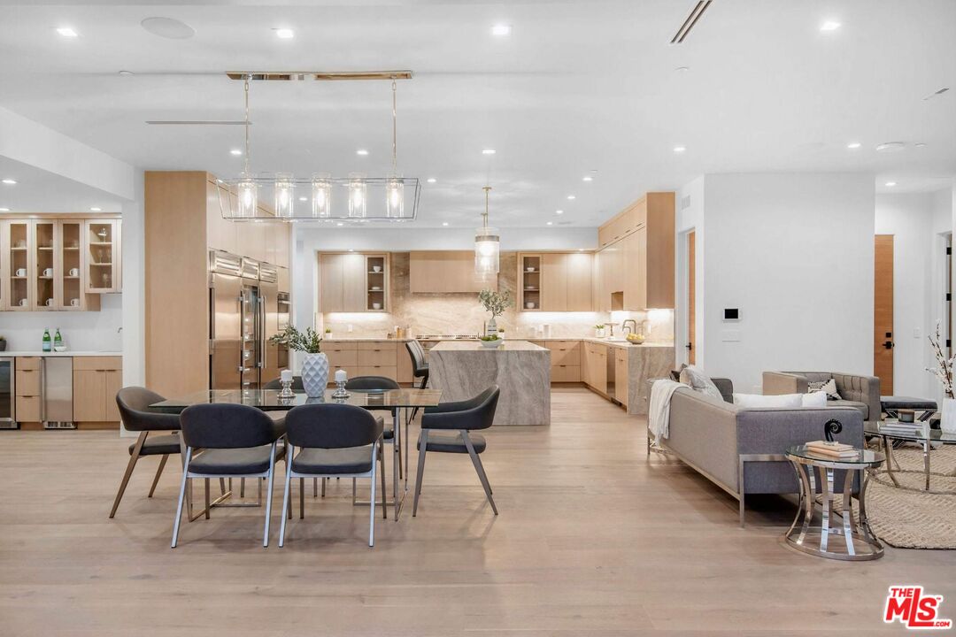 24961 Kit Carson Road Hidden Hills, CA 91302 - Photo 9 of 53 a large kitchen with a table and chairs