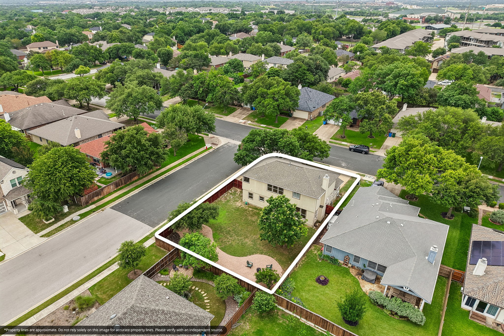 4100 Mocha Trail Austin, TX 78728 - Photo 31 of 33 An aerial perspective reveals a private, fenced yard within a lush, tree-lined neighborhood.