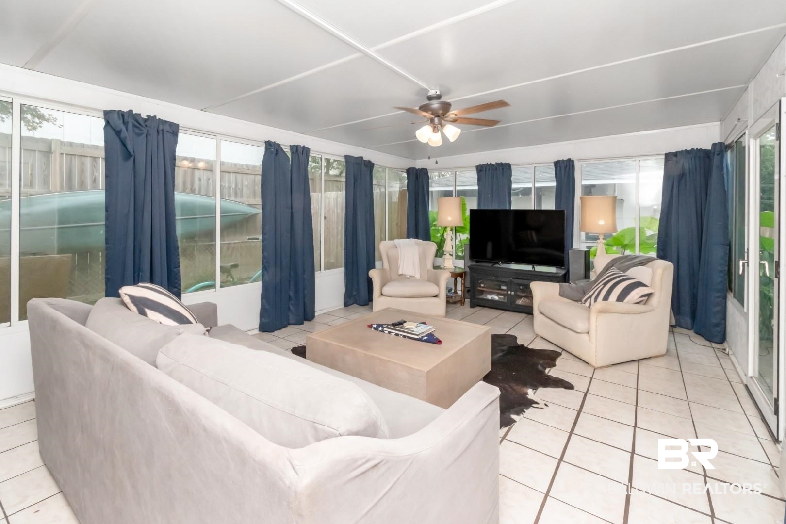 20 Kirby Street Mobile, AL 36607 - Photo 12 of 35 Living room featuring light tile patterned floors, a wealth of natural light, and ceiling fan