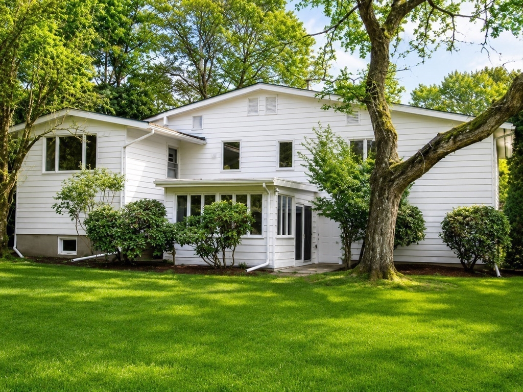 132 Brandeis Road Newton, MA 02459 - Photo 10 of 10 a front view of house with a garden