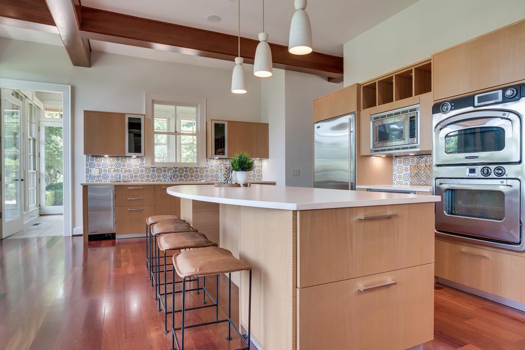 1710 Lawrence Road Franklin, TN 37069 - Photo 13 of 30 a kitchen with a sink cabinets and wooden floor