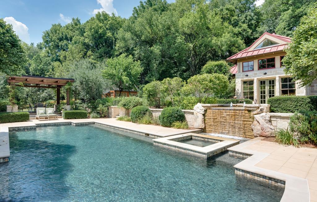 1710 Lawrence Road Franklin, TN 37069 - Photo 18 of 30 a view of a patio with a table and chairs under an umbrella