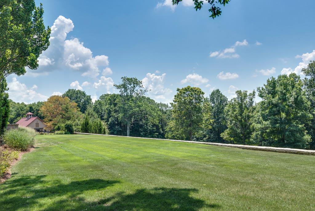 1710 Lawrence Road Franklin, TN 37069 - Photo 22 of 30 a view of a grassy field with trees