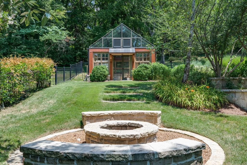 1710 Lawrence Road Franklin, TN 37069 - Photo 30 of 30 a front view of a house with a yard table and chairs