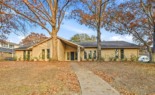 front view of a house with a trees