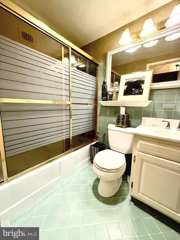 a bathroom with a toilet a sink and a bathtub