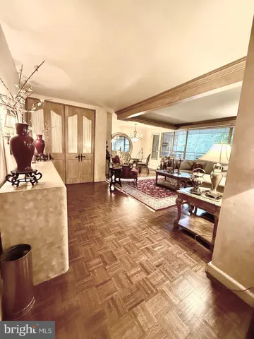 a living room filled with furniture gym equipment and a large window