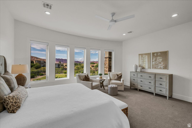 2608 Canyon Ridge Drive St. George, UT 84770 - Photo 71 of 86 Spacious interior featuring a series of large windows, recessed ceiling lighting, a modern ceiling fan, and light-colored carpeting