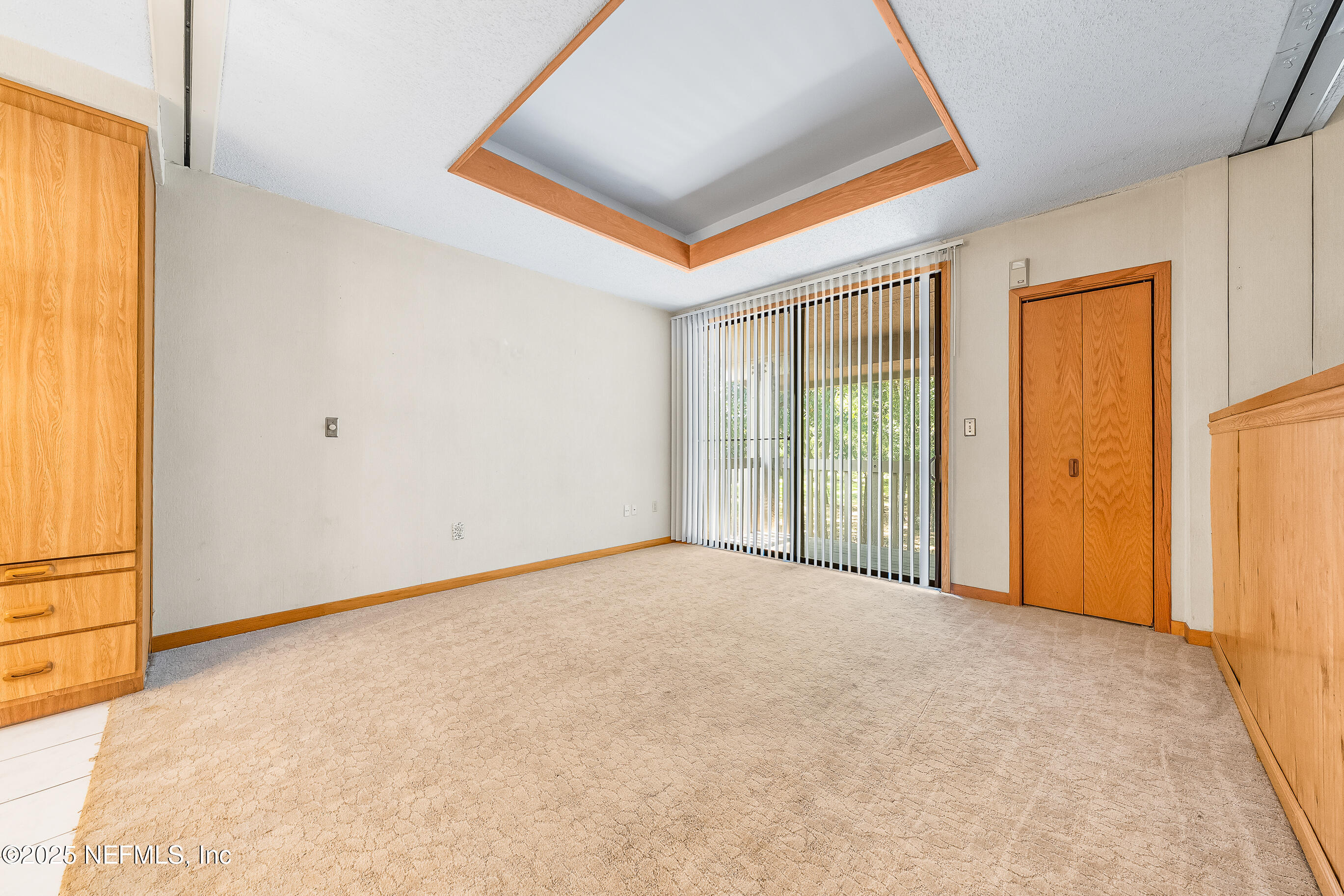 2930 Ravines Road, Unit 1226 Middleburg, FL 32068 - Photo 18 of 30 an empty room with windows