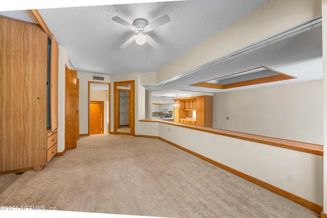 a view of a livingroom with an empty space and window