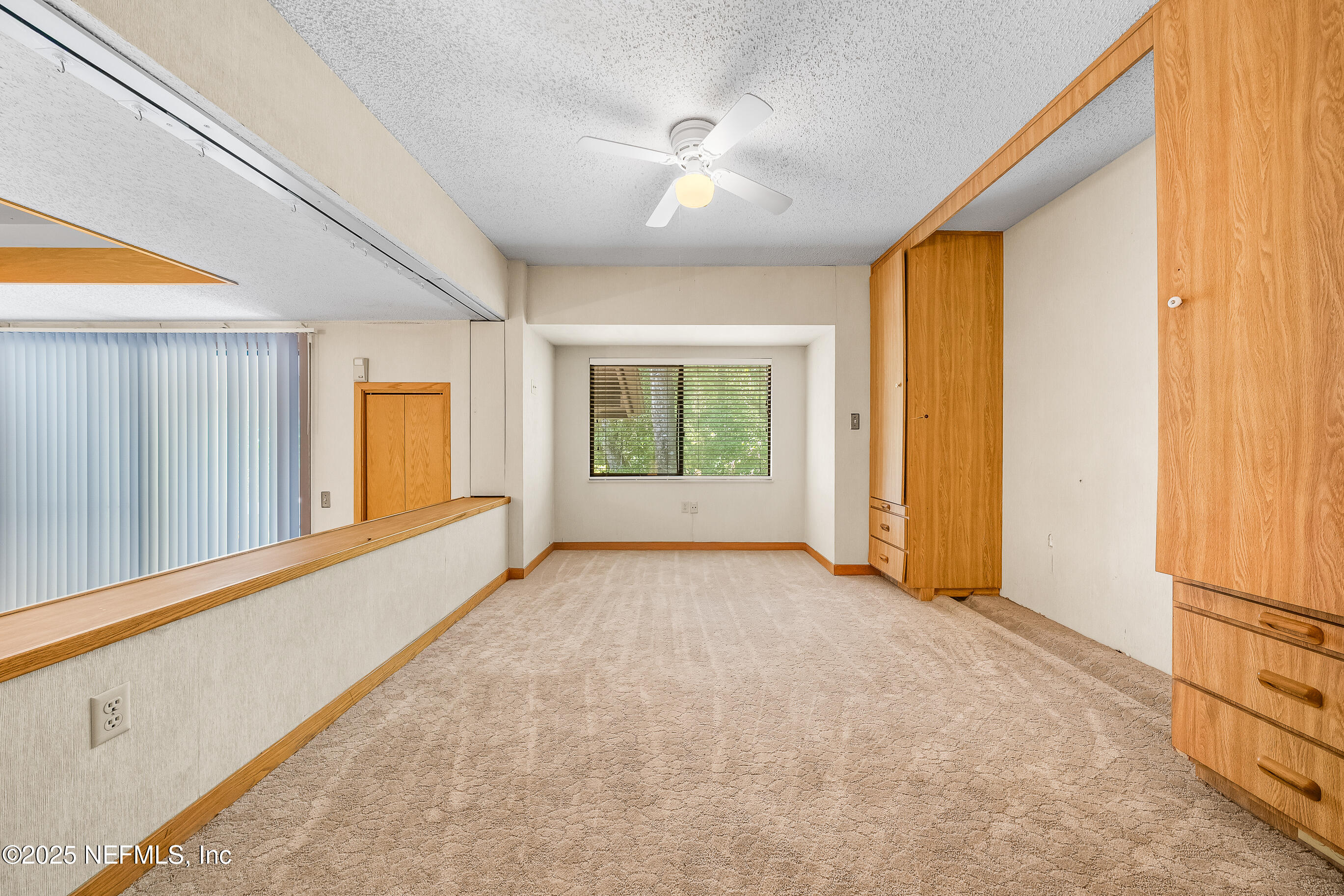 2930 Ravines Road, Unit 1226 Middleburg, FL 32068 - Photo 26 of 30 a view of a livingroom with an empty space and window
