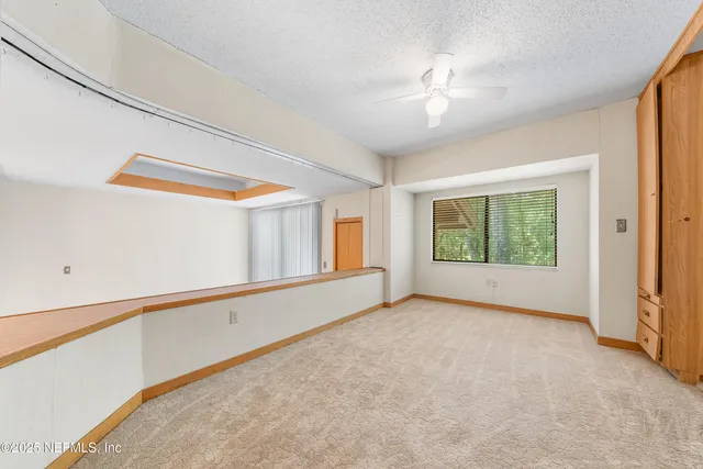 a view of balcony with wooden floor