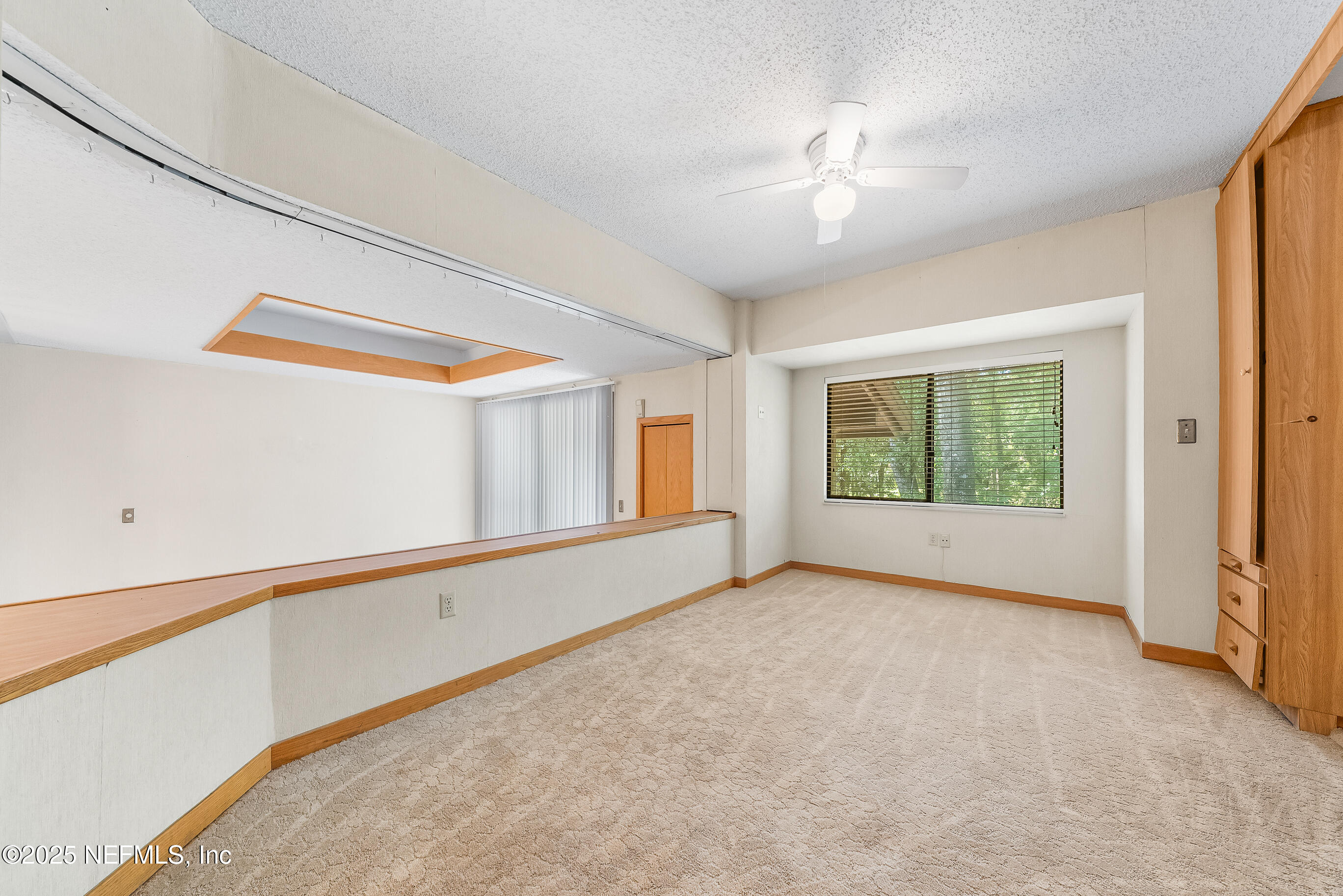 2930 Ravines Road, Unit 1226 Middleburg, FL 32068 - Photo 27 of 30 a view of an empty room with a window