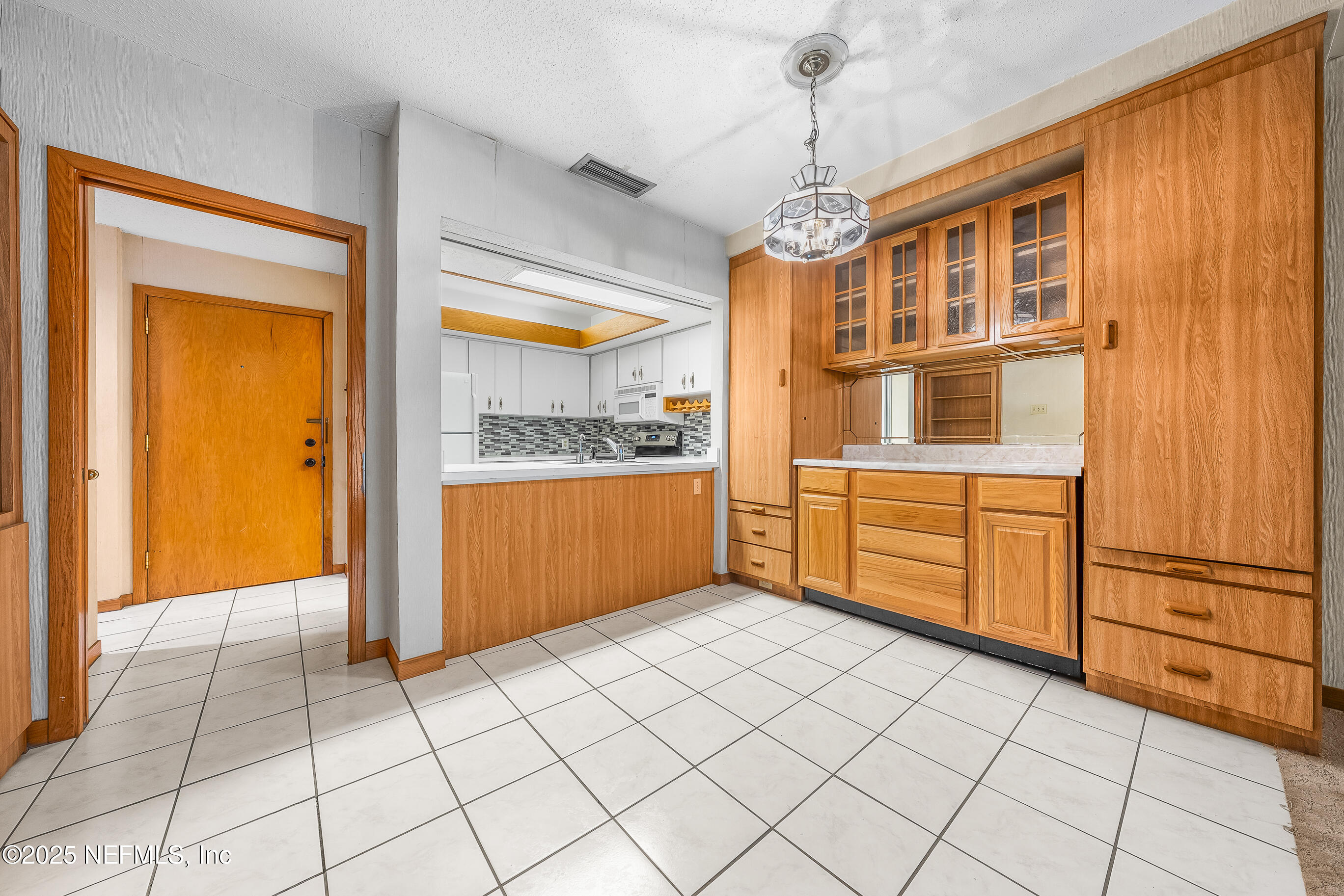 2930 Ravines Road, Unit 1226 Middleburg, FL 32068 - Photo 8 of 30 a kitchen with stainless steel appliances granite countertop a refrigerator and a stove top oven