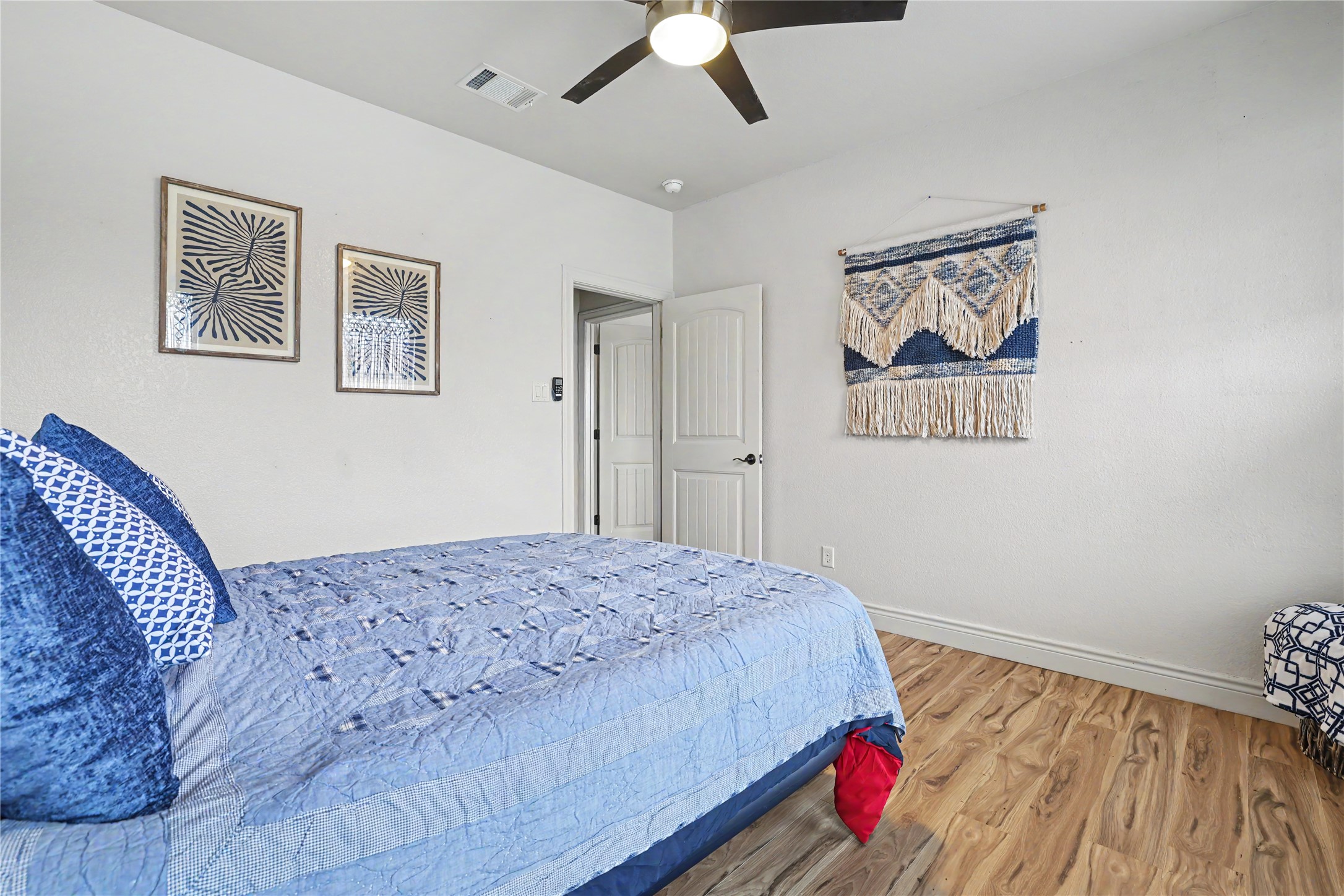 Undisclosed Address Georgetown, TX 78633 - Photo 29 of 39 a bedroom with a bed and a painting on the wall