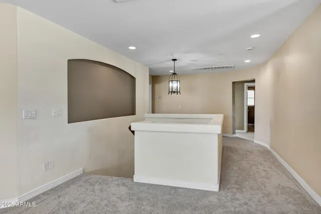 a spacious bedroom with a bed and a fireplace