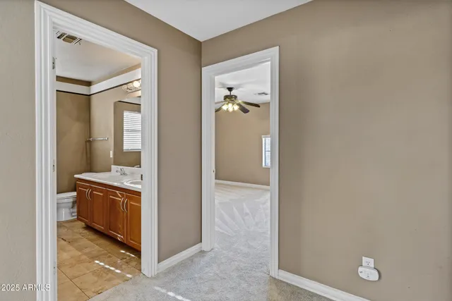 a bathroom with a sink a bathtub and a mirror