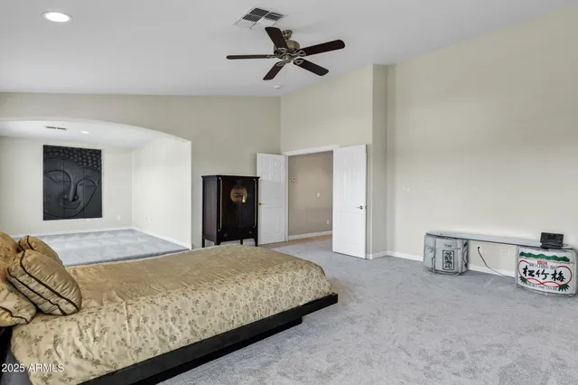 a view of a patio with table and chairs and couches with wooden floor and fence