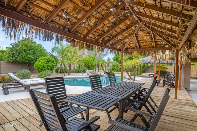 a view of a swimming pool with a patio