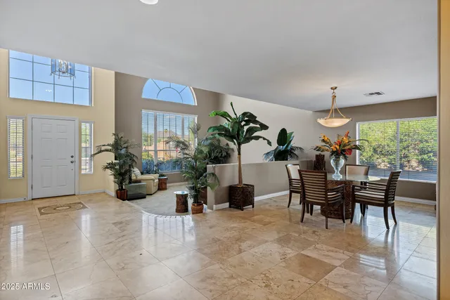 a kitchen with stainless steel appliances granite countertop a refrigerator a stove top oven a sink and dishwasher