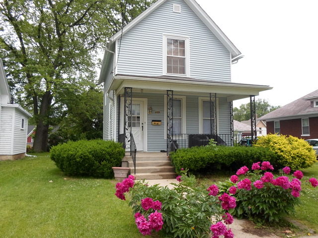 225 Perry Street Elgin, IL 60123 - Photo 5 of 10 a view of a house with the garden