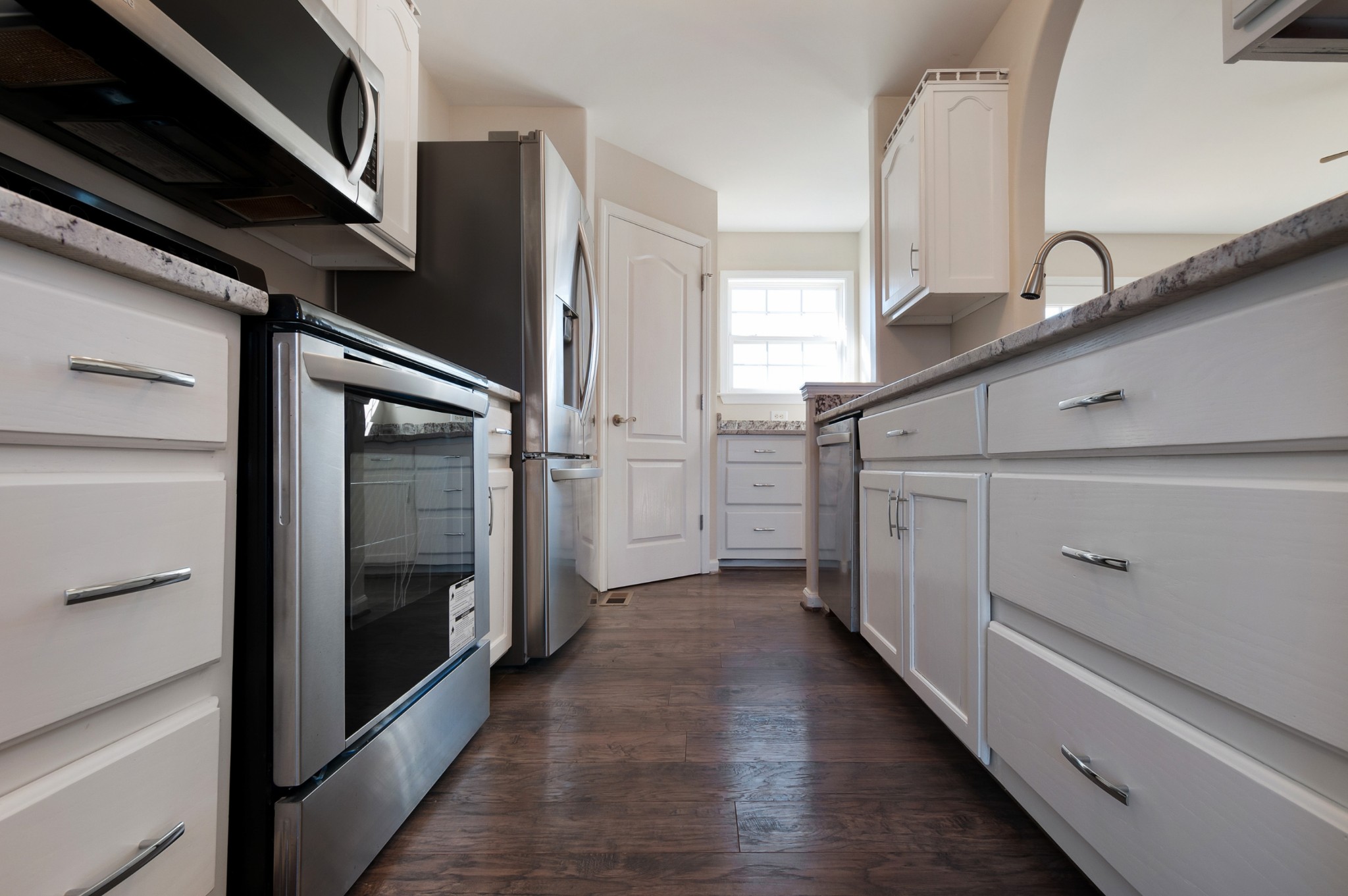 1933 Clara Mathis Road Spring Hill, TN 37174 - Photo 16 of 50 a kitchen with stainless steel appliances cabinets and a refrigerator
